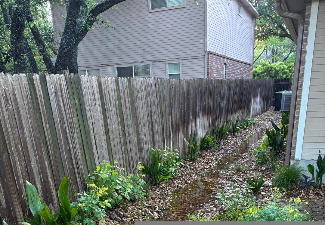 Stormwater moving through the finished rain-garden channel after rainfall.