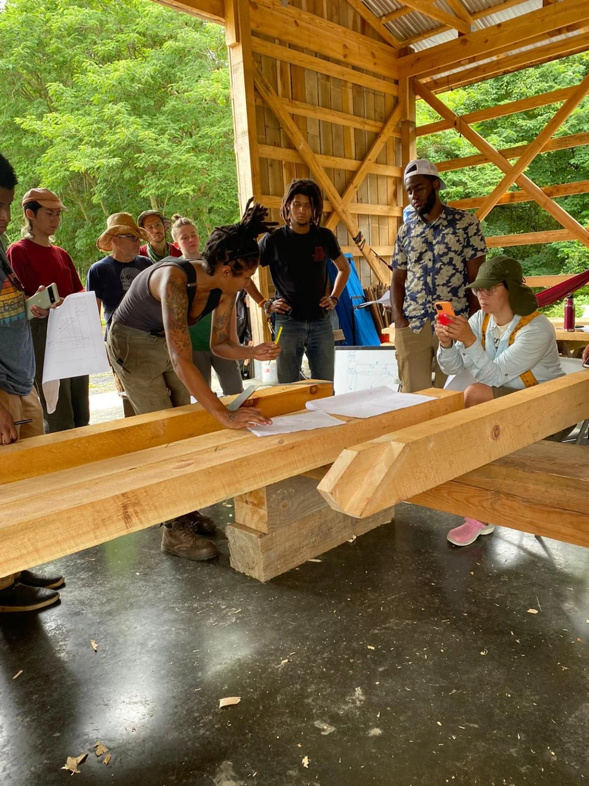 Traditional timber-frame joinery layout marked on a timber during class.