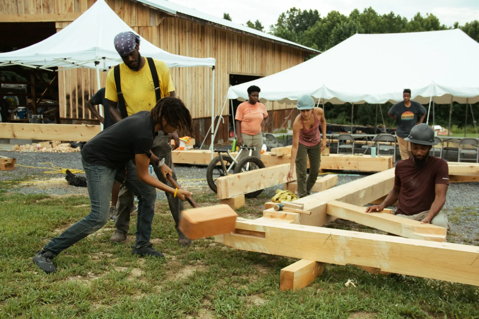 Pavilion timbers being assembled during a timber-framing class.