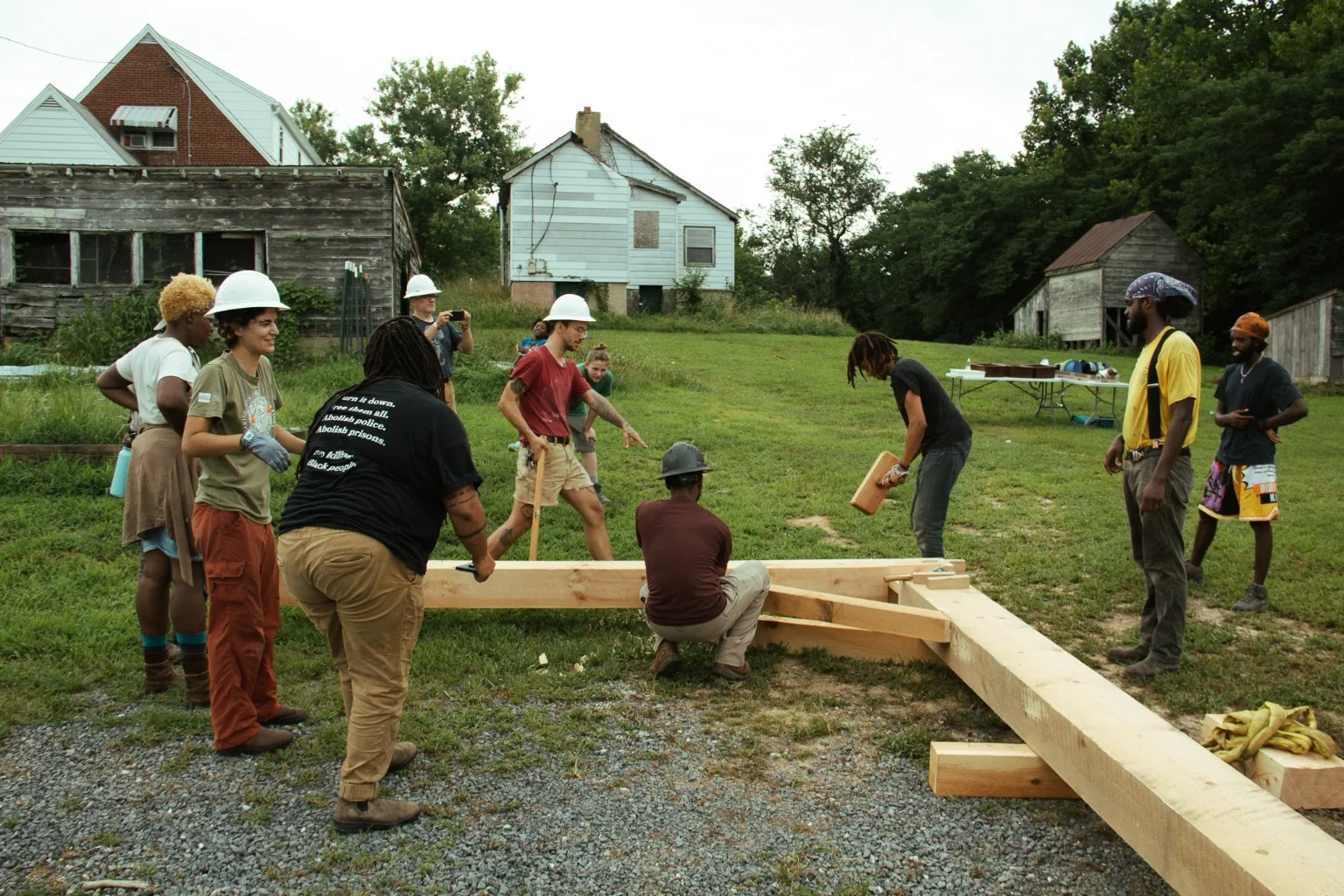 Timber-frame pavilion layout and assembly during training.
